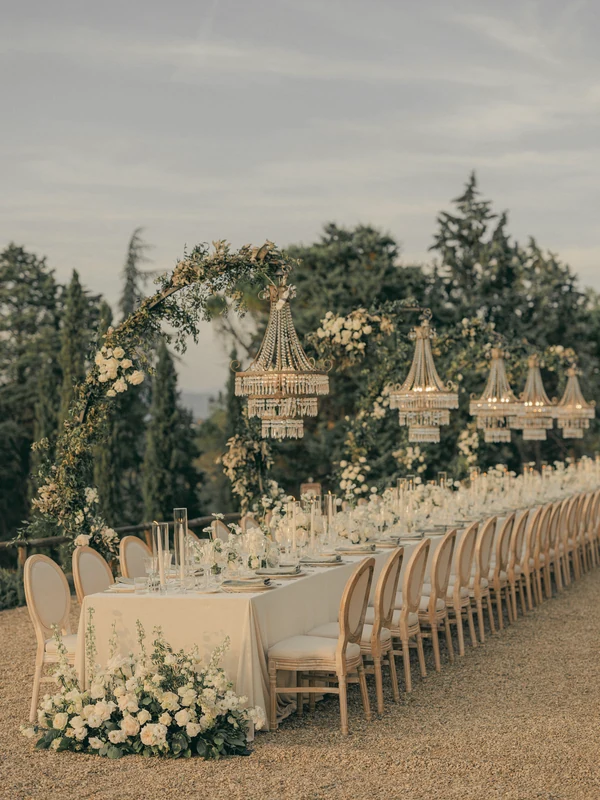 An elegant outdoor wedding reception designed with natural florals.